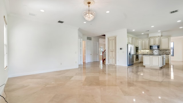 interior space with hanging light fixtures, backsplash, appliances with stainless steel finishes, an inviting chandelier, and ornamental molding