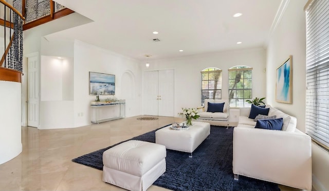 living room with ornamental molding