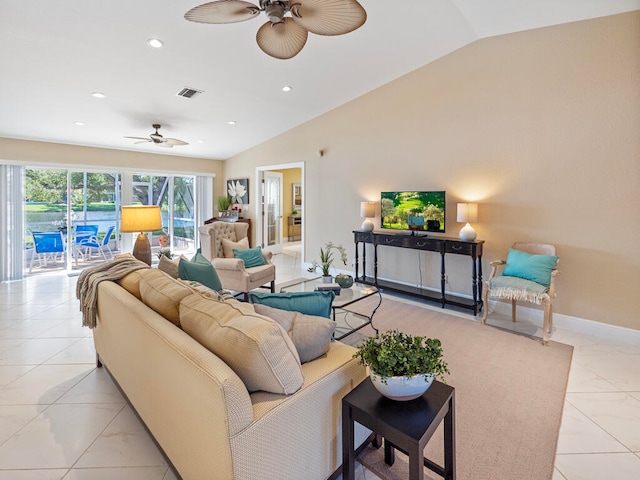 living room featuring ceiling fan and lofted ceiling