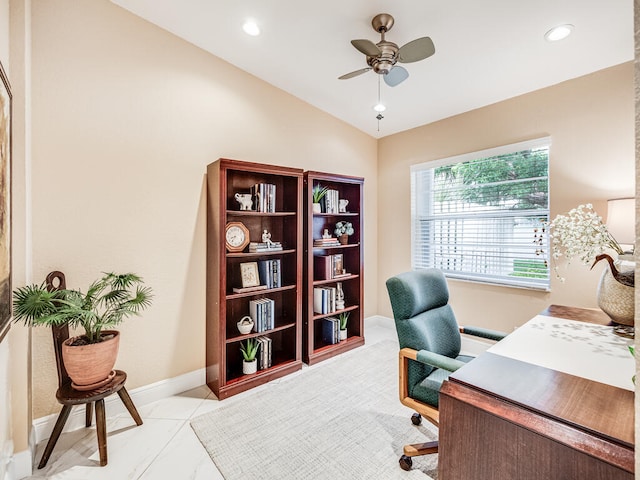 tiled home office featuring vaulted ceiling and ceiling fan