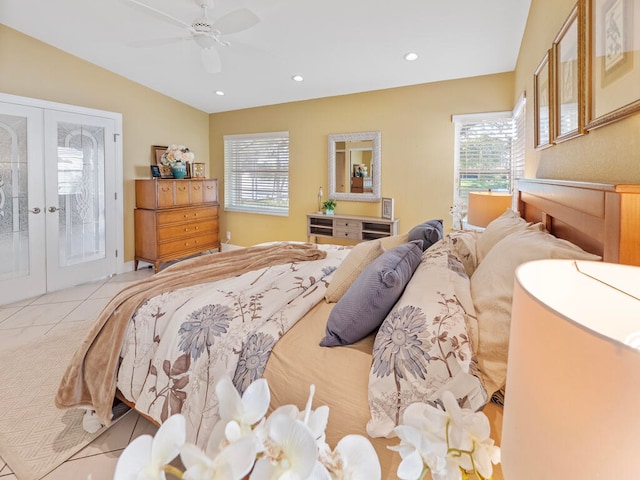 tiled bedroom with french doors, vaulted ceiling, access to outside, and ceiling fan