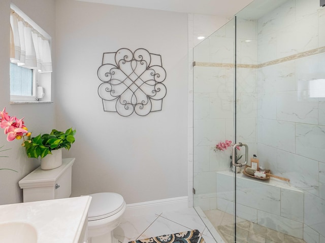 bathroom with vanity, toilet, and a shower with shower door