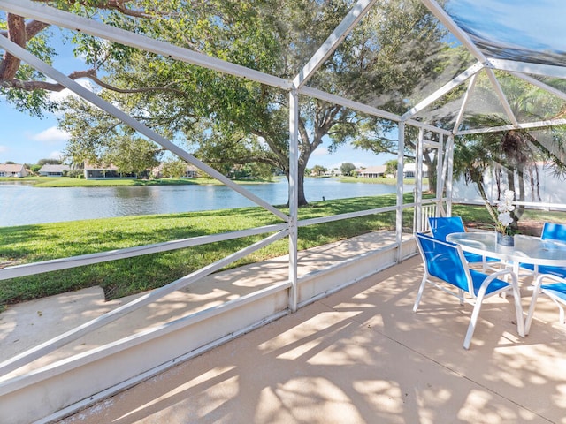 unfurnished sunroom with a water view