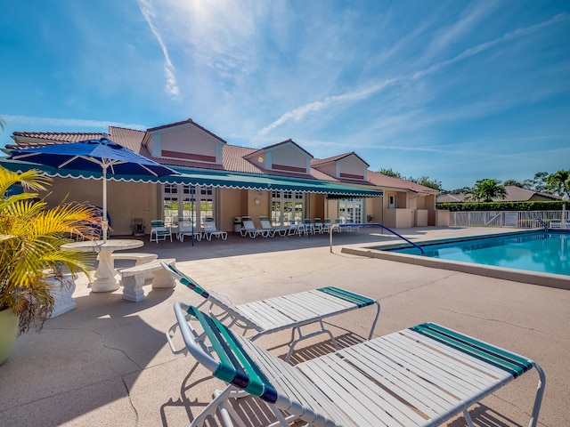 view of pool featuring a patio