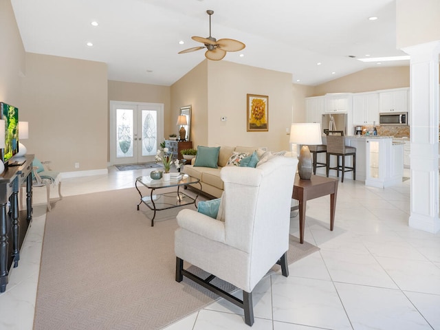 living room featuring french doors, ceiling fan, lofted ceiling, and light tile patterned floors