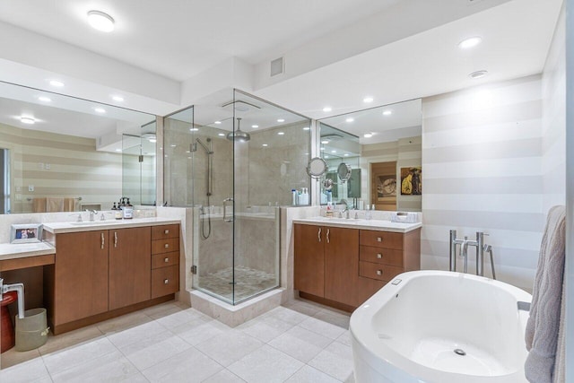 bathroom featuring vanity, separate shower and tub, and tile patterned floors