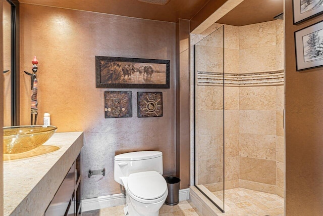 bathroom featuring toilet, walk in shower, and vanity