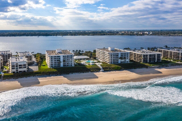 bird's eye view with a water view and a view of the beach