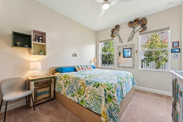 bedroom with ceiling fan and carpet flooring