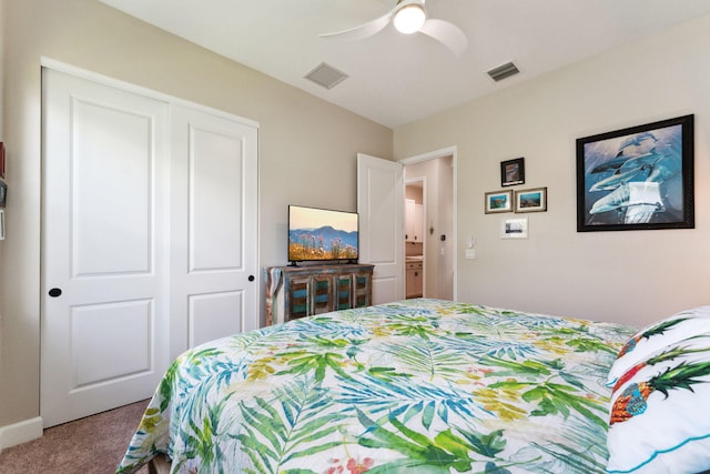 bedroom with ceiling fan, carpet floors, and a closet