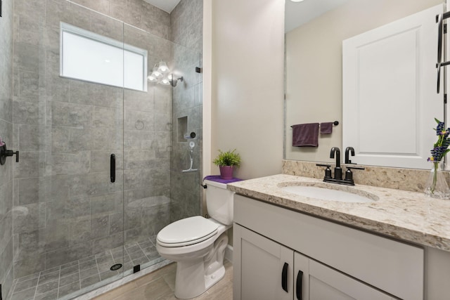 bathroom with vanity, toilet, an enclosed shower, and hardwood / wood-style flooring