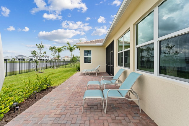 view of patio with a water view