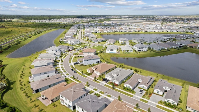 drone / aerial view with a water view