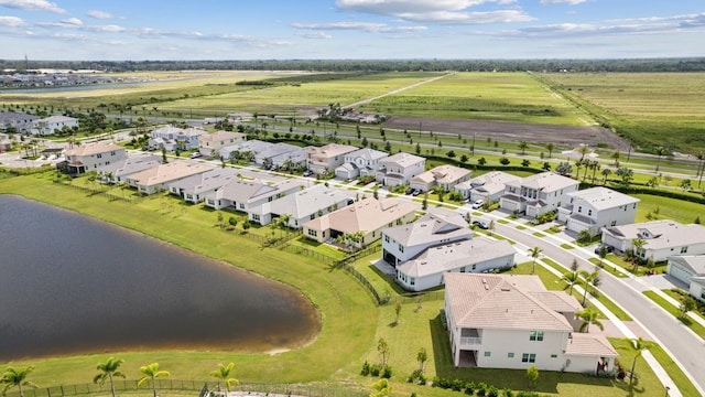 birds eye view of property featuring a water view and a rural view