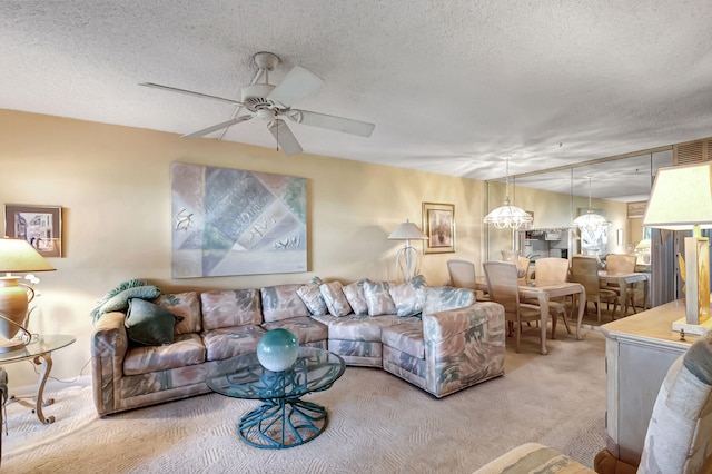 living room with light carpet, a textured ceiling, and ceiling fan