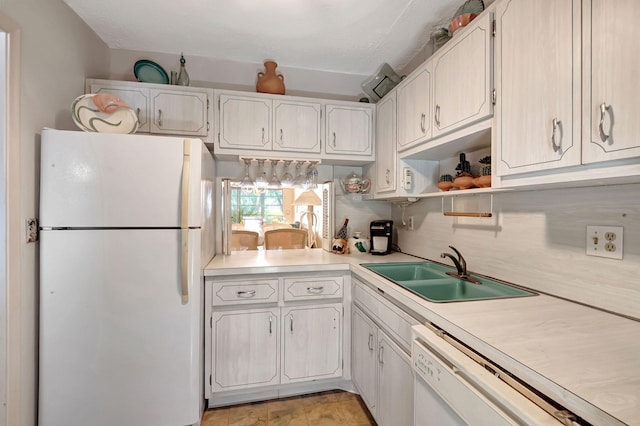 kitchen featuring sink, white cabinets, a textured ceiling, and white appliances