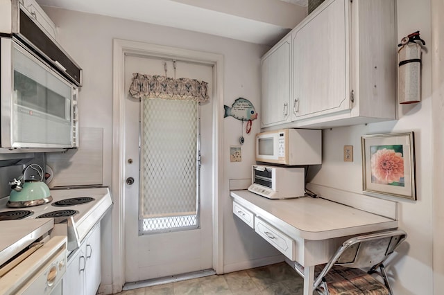 kitchen with white cabinetry and stainless steel appliances