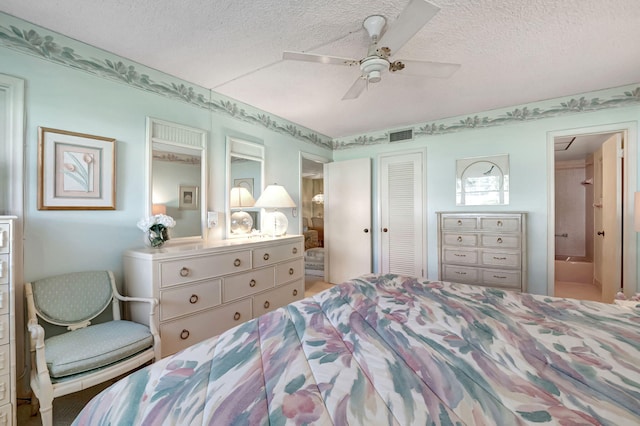 bedroom featuring a closet, a textured ceiling, connected bathroom, and ceiling fan