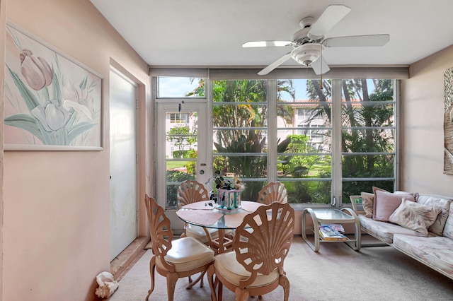 sunroom / solarium with ceiling fan