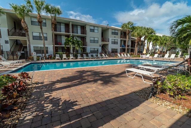 view of swimming pool featuring a patio area