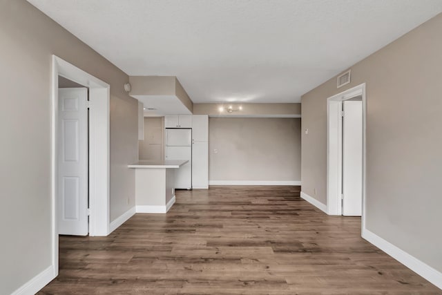 empty room featuring hardwood / wood-style flooring