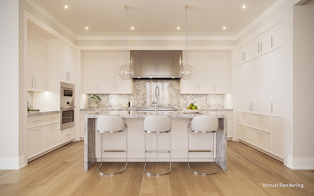 kitchen featuring white cabinets, light hardwood / wood-style floors, and hanging light fixtures