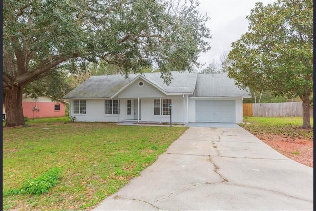 single story home with a porch, a garage, and a front yard