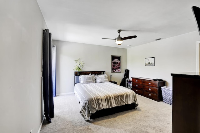 bedroom featuring ceiling fan and light colored carpet