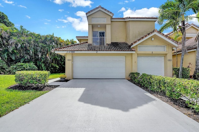 mediterranean / spanish-style home featuring a garage