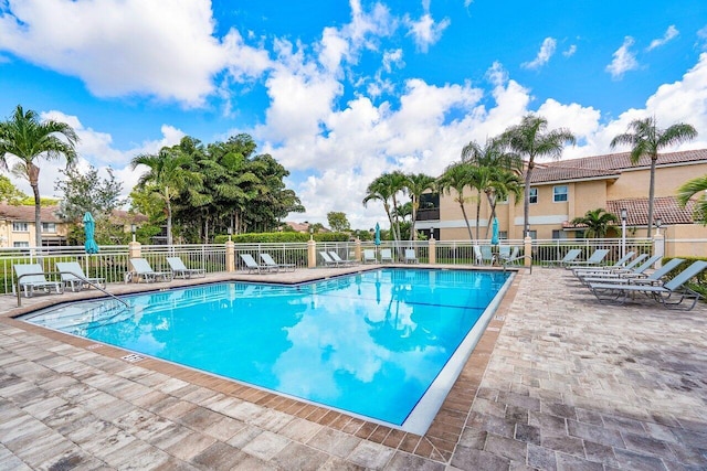 view of swimming pool featuring a patio area