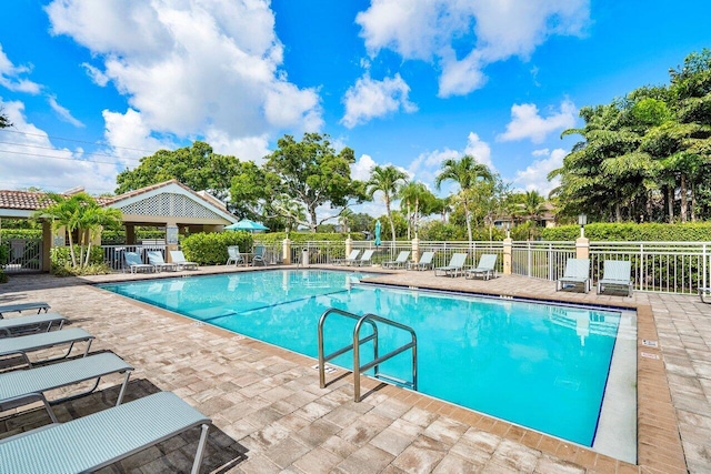 view of swimming pool featuring a patio area