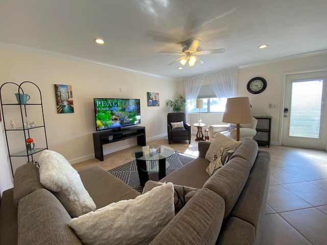 tiled living room with ceiling fan and crown molding