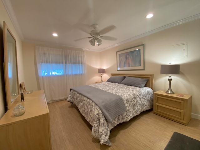 bedroom with ornamental molding, light wood-type flooring, and ceiling fan