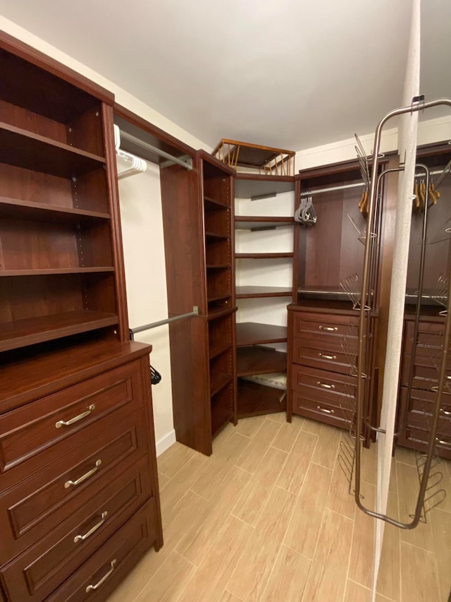 walk in closet featuring light wood-type flooring