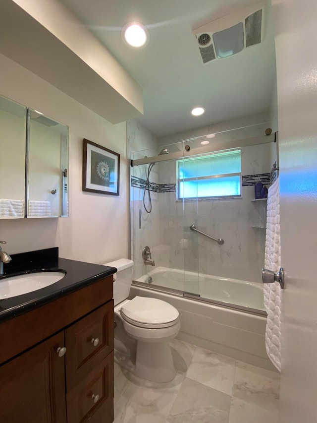 full bathroom with shower / bath combination with glass door, vanity, and toilet