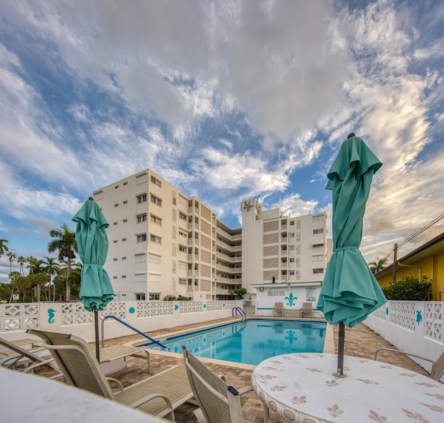 view of swimming pool featuring a patio area