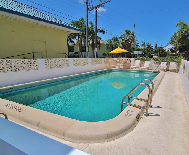 view of swimming pool featuring a patio