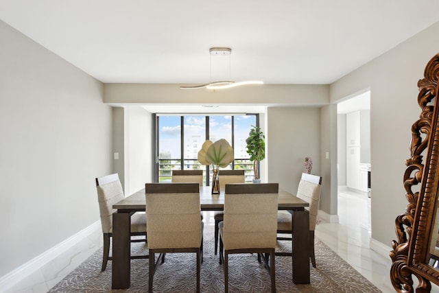 dining area featuring tile patterned floors