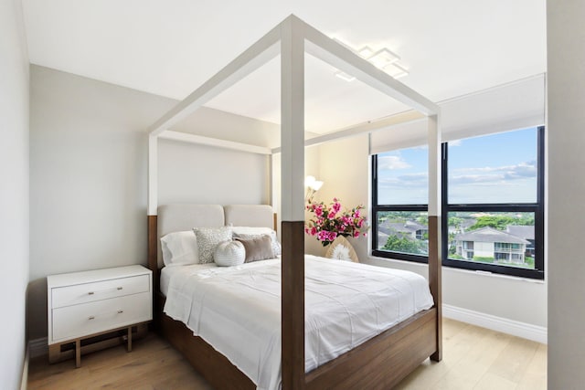 bedroom featuring light wood-type flooring