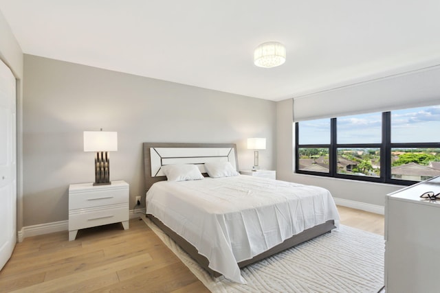 bedroom with light hardwood / wood-style floors