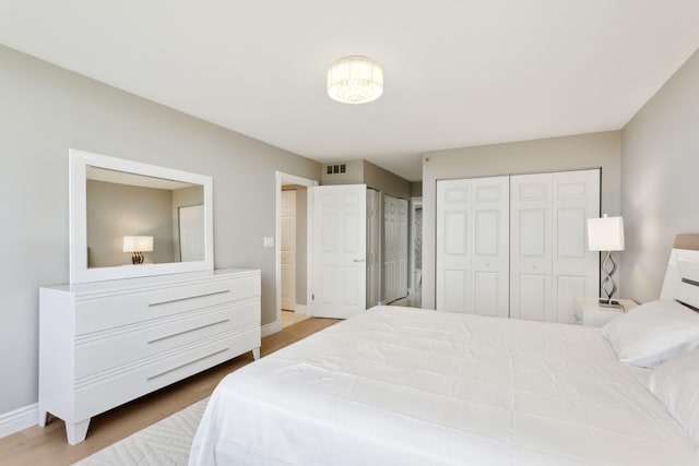 bedroom with hardwood / wood-style floors