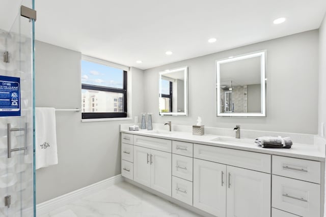 bathroom featuring an enclosed shower and vanity