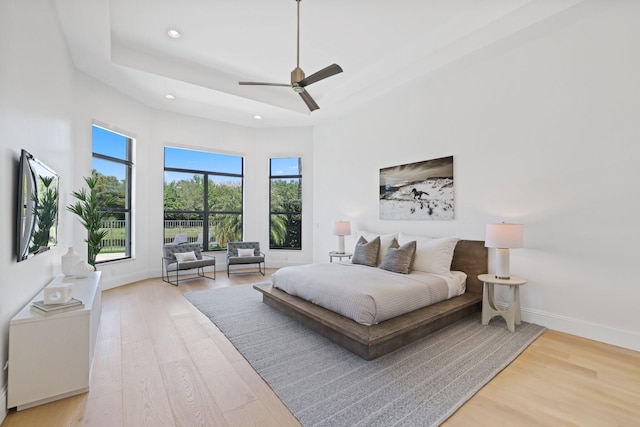 bedroom featuring ceiling fan and light hardwood / wood-style floors