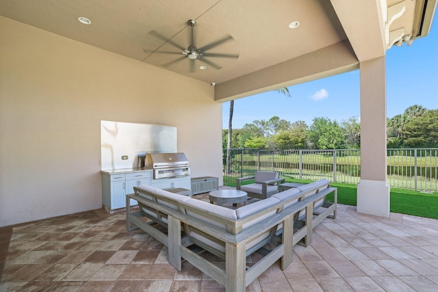 view of patio / terrace with area for grilling and ceiling fan