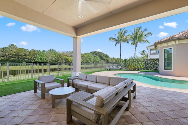 view of patio / terrace featuring a fenced in pool and an outdoor living space