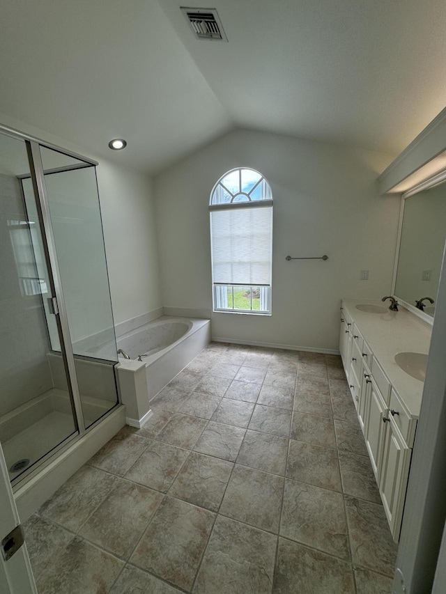 bathroom featuring shower with separate bathtub, lofted ceiling, vanity, and tile patterned floors