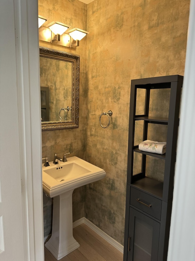 bathroom with wood-type flooring