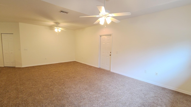 unfurnished room with carpet and ceiling fan