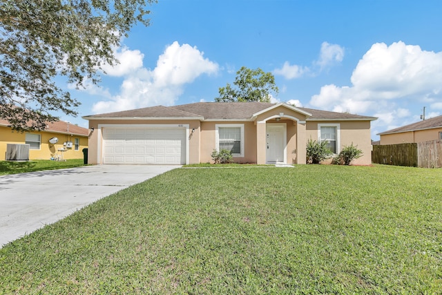 ranch-style home featuring a garage and a front lawn