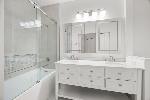 bathroom with shower / bath combination with glass door and vanity